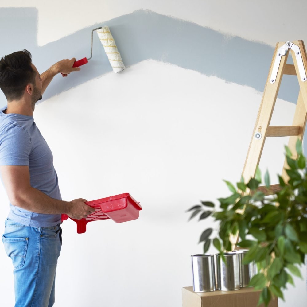 Rear view of man while doing some housework